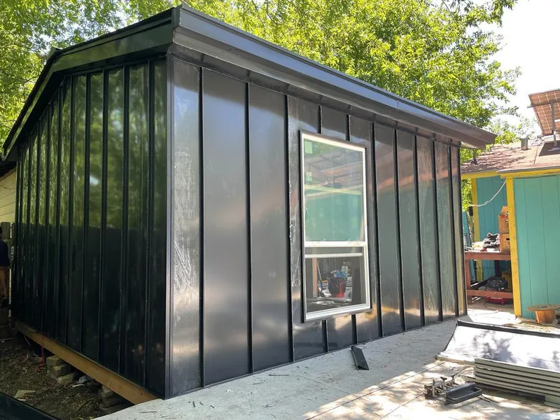 Black standing seam metal wall panels for Roof Inspection in Olney